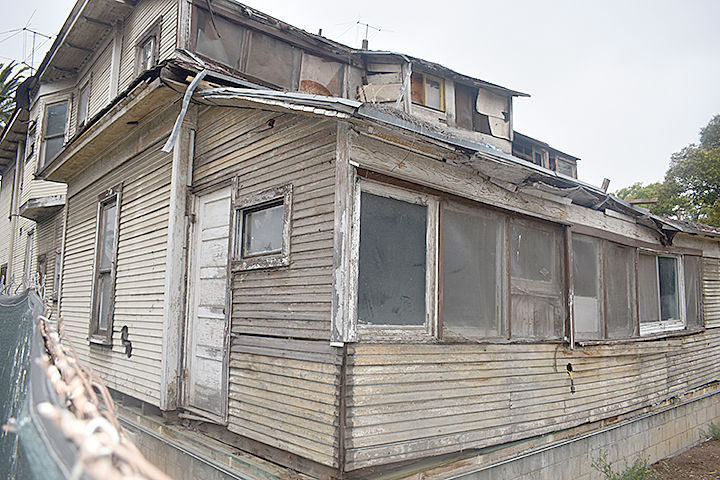 Back of a dilapidated apartment complex